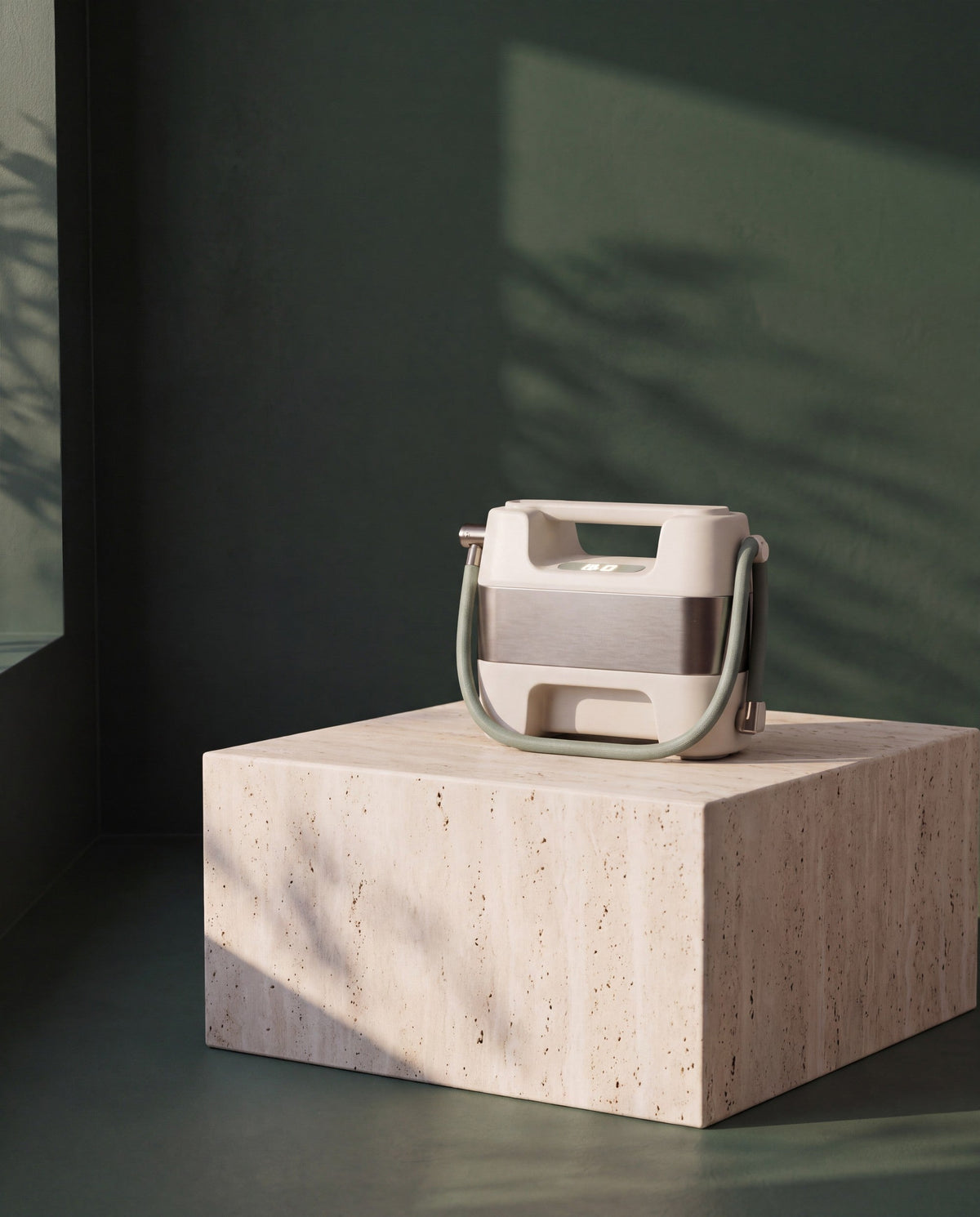 Portable Tire Inflator on a travertine plinth