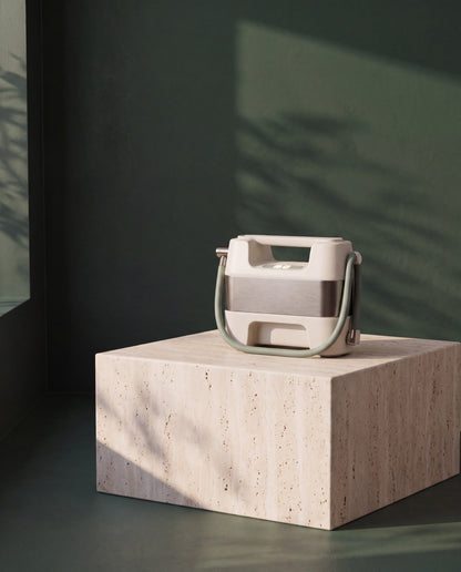 Portable Tire Inflator on a travertine plinth