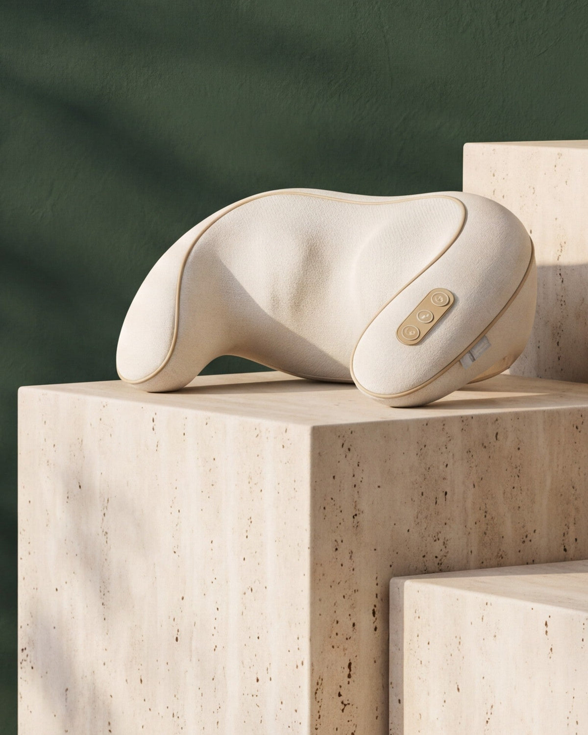 Heated Neck & Shoulder Massager on a travertine plinth