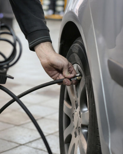 Connecting an air hose to a car tire valve